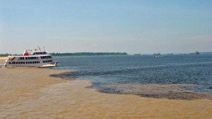 The dark-coloured waters of the Negro the muddy waters of the Solimões flow side by side for over 18 kilometres without mixing