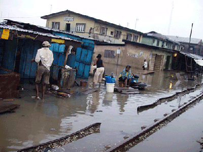 No train in sight rev up a wet and gloomy rail line community at Agege, Lagos