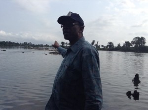 Bassey standing by the Goi Creek