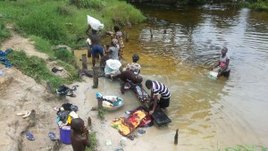 Performing domestic chores by the Nkisa River in Ebocha. Photo credit: Dandy Mgbenwa
