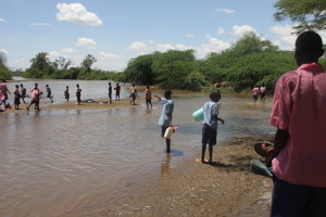 Children of Katilu Primary School fetching water at River Turkwel