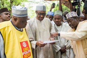 Mr President listens as officials explain a point