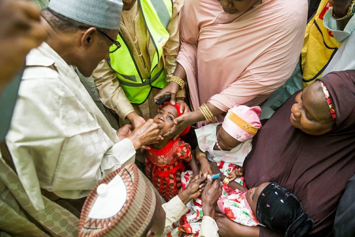President Muhammadu Buhari administering the vaccine