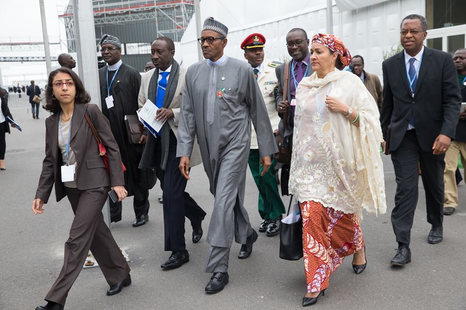 President Buhari making his exit in company of Environment Minister, Mrs Amina Mohammed