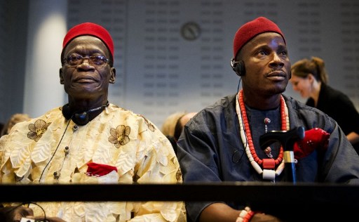 Two of the four Nigerian farmers (Chief Fidelis A. Oguru-Oruma (left) and Eric Dooh) sit in the law courts in The Hague on October 11, 2012. The four farmers take on Shell in a Dutch court, accusing the oil giant of destroying their livelihoods in a case that could set a precedent for global environmental responsibility. Photo credit: AFP / ANP / ROBIN UTRECHT  netherlands out