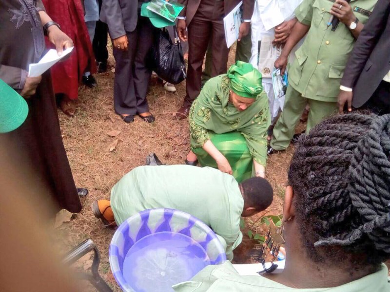 The minister planting a tree at the event