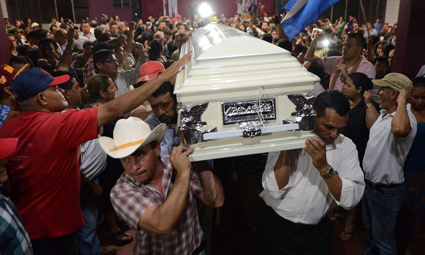 Relatives and friends carry the coffin of murdered indigenous activist Berta Cáceres. Around the world in 2014, the killings averaged two a week, according to Global Witness. Photo credit: Orlando Sierra/AFP/Getty Images