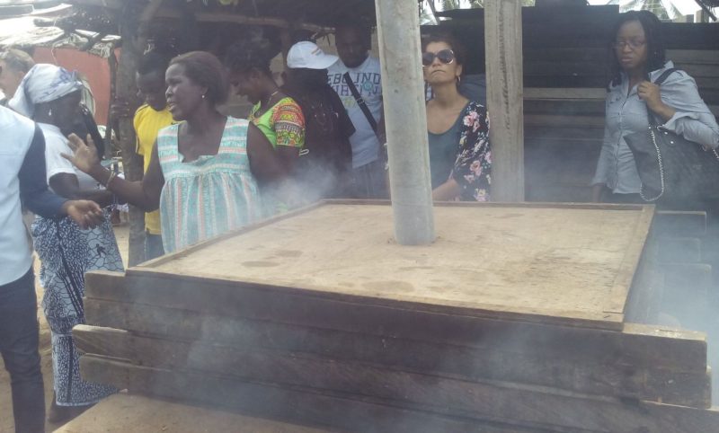 Fish being smoked with the improved Morrison stove