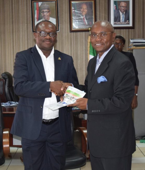 Commissioner for Urban Development and Physical Planning, Chinyere Igwe, presenting the operational guidelines of the ministry to Dr. Emi Membere-Otaji, the PHCCIMA president