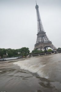 Several areas in Paris were under red alert as the Seine burst its banks Wednesday morning - one near the Eiffel Tower after days of heavy rain