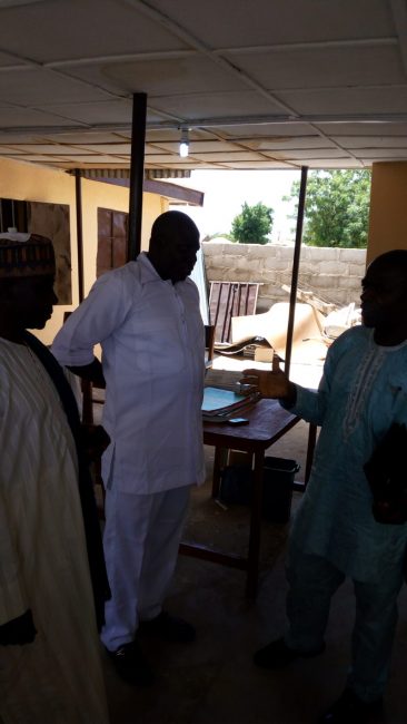 Okon Ekpenyong, an engineer and deputy director with the ECN (right) sharing a point with Mallam Ja’afaru Biyma (left) and Javan Zakaria