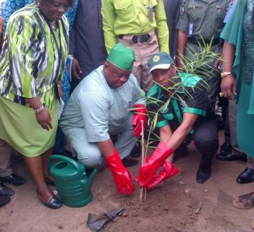 Dr. Samuel Adejare, Lagos State Environment Commissioner (left) and Mr. Tunji Bello, Secretary to the State Government (SSG), planting a tree to observe 2016 World Tree Planting Day