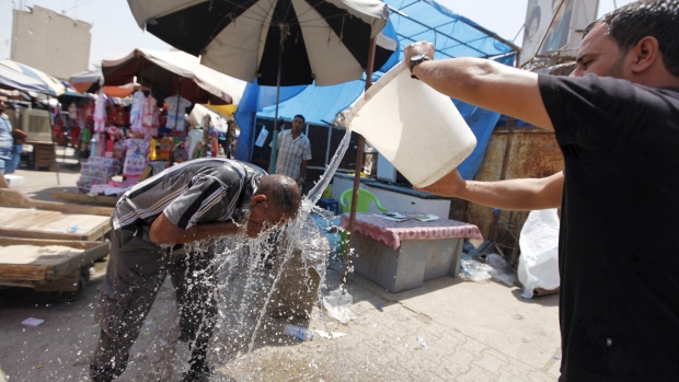 A man cools off amid the searing heat wave 