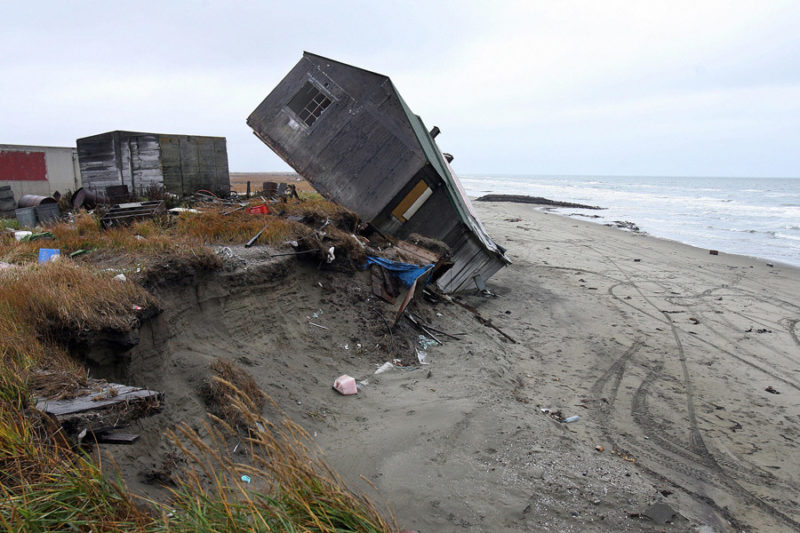 The remote village of Shishmaref, Alaska, has been experiencing the effects of climate change first-hand. In the last decades, the island’s shores have been eroding into the sea, falling off in giant chunks whenever a big storm hits. Photo credit:: Gabriel Bouys/AFP/Getty Images