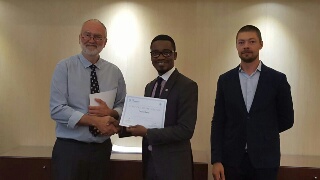 Environment Expert, United Nations Industrial Development Organisation (UNIDO) Regional Office in Abuja, Mr Oluyomi Banjo (middle) receiving a certificate at the close of the training