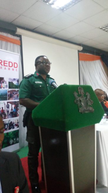 Governor Ben Ayade of Cross River State, dressed as a Green Police, delivering a speech at the Calabar validation exercise