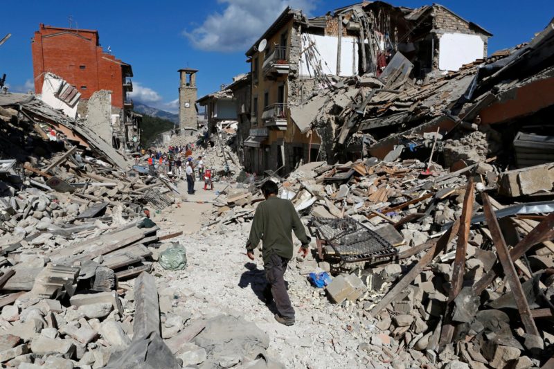 A man walks amid the rubble in Pescara del Tronto. Photo credit: Remo Casilli / Reuters