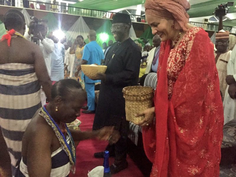 Amina Mohammed receives a traditional basket from an Alago Dancer 
