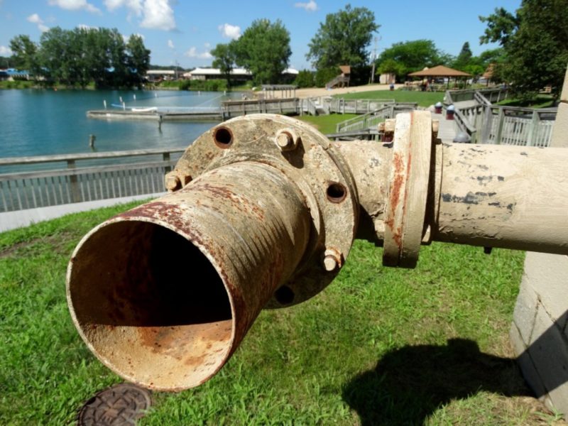 A drinking water well structure at Versluis Park in Plainfield Township, Mich. Utilities serving the area recently reported elevated levels of two potentially toxic industrial chemicals in both raw and treated water. Photo credit: Garret Ellison/The Grand Rapids Press via AP