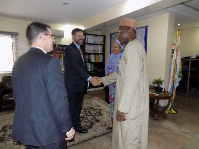 Dr Pershin in a handshake with Mallam Ibrahim Jibril, the Environment Minister of State, as Jibril and Environment Minister, Amina Mohammed, welcome the envoy to the ministry's head offices in Abuja