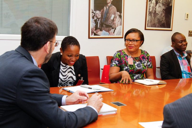 The envoy exchanges pleasantries with Miss Esther Agbarakwe, an aide to the Environment Minister