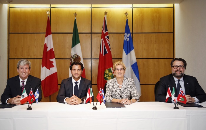 Ontario Premier Kathleen Wynne (third from left), in Guadalajara, Mexico at the 2016 Climate Summit of the Americas, met with Ontario Minister of the Environment and Climate Change Glen Murray (left), Secretary of Environment and Natural Resources of Mexico Rafael Pacchiano Alamán (second from left) and Québec Minister of Sustainable Development, Environment and the Fight against Climate Change David Heurtel (right) before they signed a new joint agreement committing Ontario, Québec and Mexico to working together to fight climate change and advance carbon markets. 