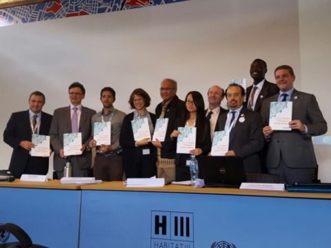 ISOCARP members with copies of the publication in Quito