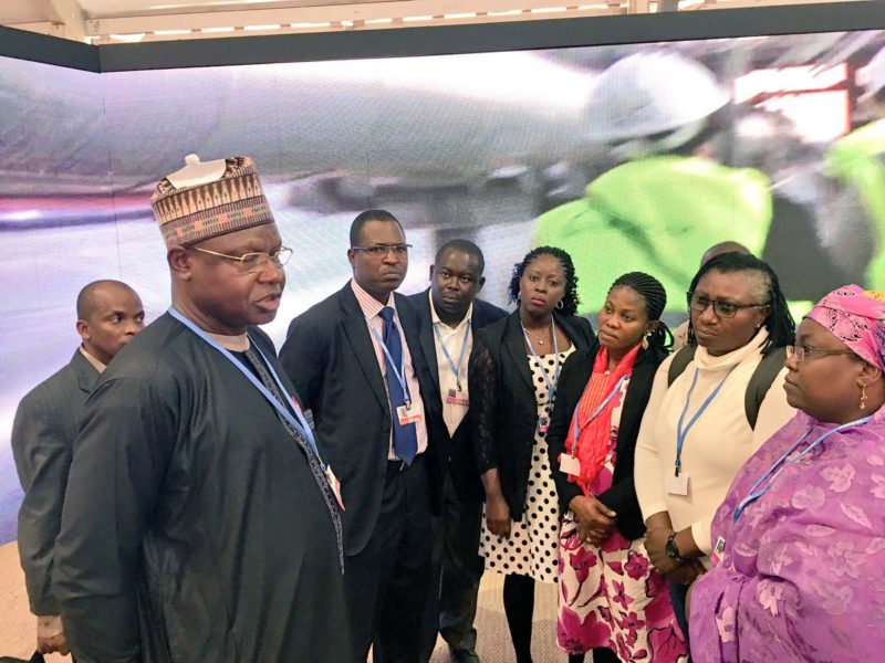 Environment Minister of State, Ibrahim Jibril (left), briefing members of the country’s delegation to the COP on Tuesday