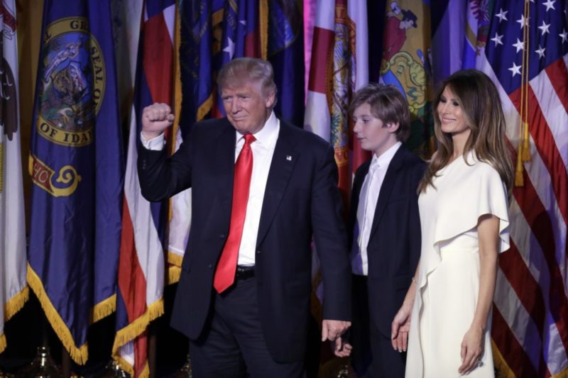 U.S. President-elect Donald Trump pumps his fist after giving his acceptance speech as his wife Melania Trump, right, and their son Barron Trump follow him during his election night rally in New York. Photo credit: AP Photo/John Locher