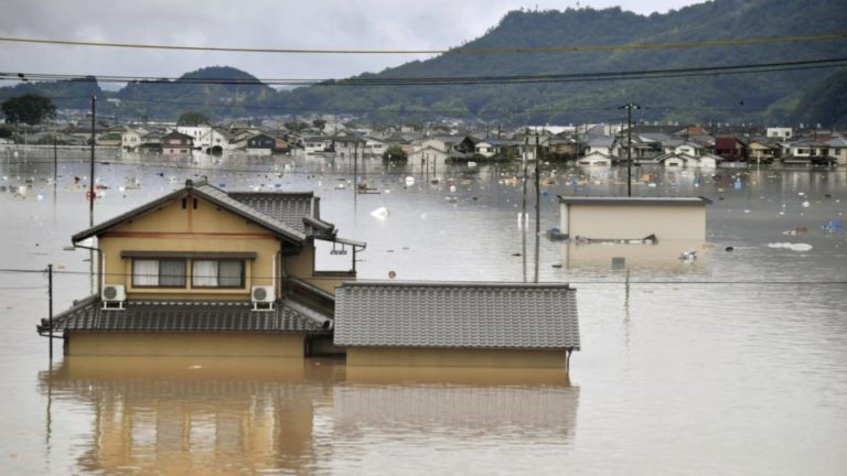 Japan struggles to deliver relief to victims of worst floods in decades
