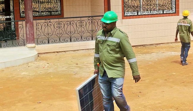 Gaston Claude Songo about to install solar panels